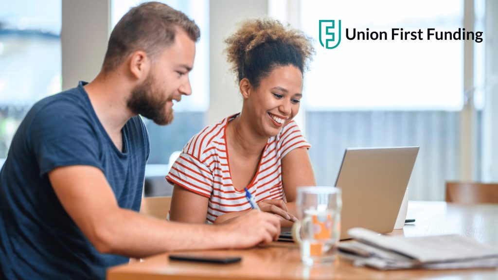 man-and-woman-looking-at-laptop